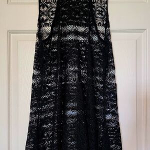 Polyester lace black bathing suit cover up. Medium